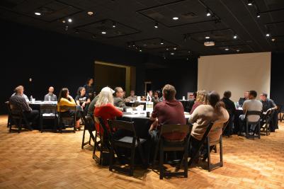 group of people sitting at round tables