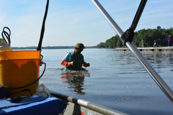 scientist wading in water