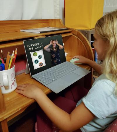 little girl using laptop