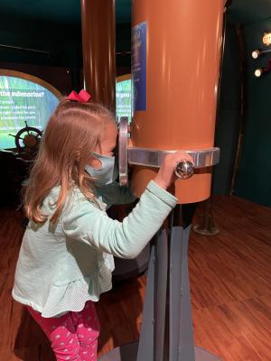 girl looking through parascope