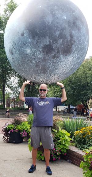 man holding big moon